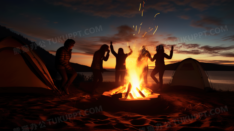夜晚户外露营在篝火旁狂欢的朋友们摄影图