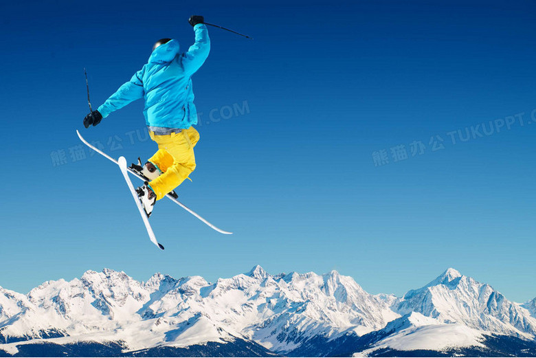 雪山上跃起的滑雪者海报背景