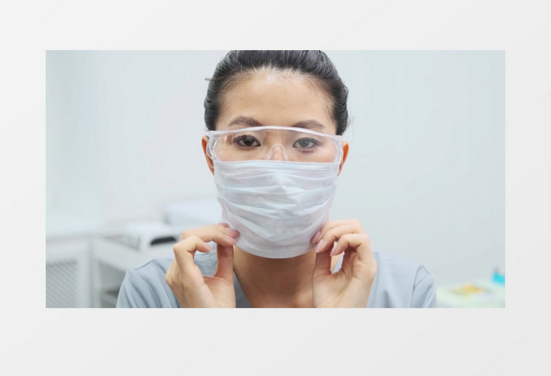 戴着护目镜的美女在戴口罩实拍视频素材