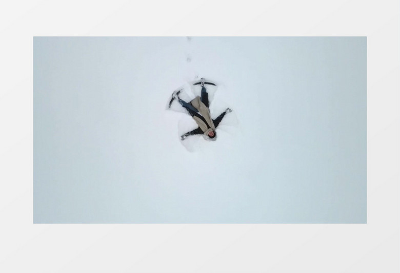 一个人躺在雪地上画图实拍视频素材