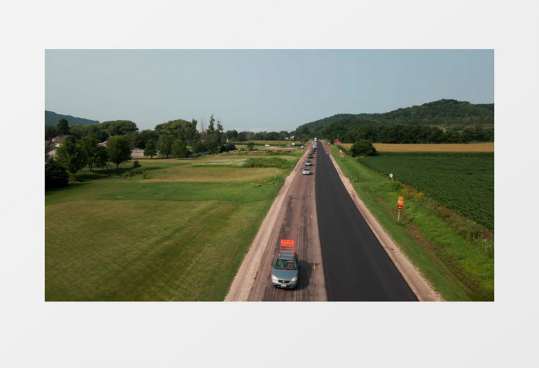 航拍车队有序通过道路实拍视频素材