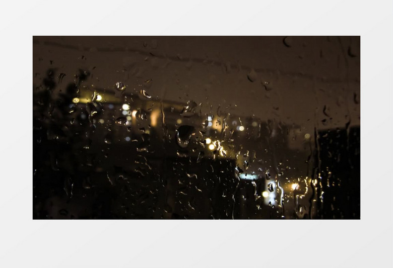 晚上雨滴飘落在玻璃上的美景实拍视频素材
