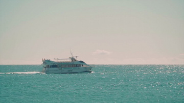 高清实拍一艘轮船在海里缓慢移动一群海鸥在天上飞实拍视频素材