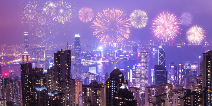 创意城市夜景燃放烟花庆祝背景