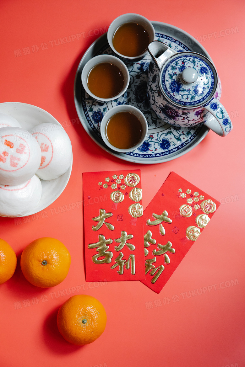 特写春节红包橘子茶壶背景图片