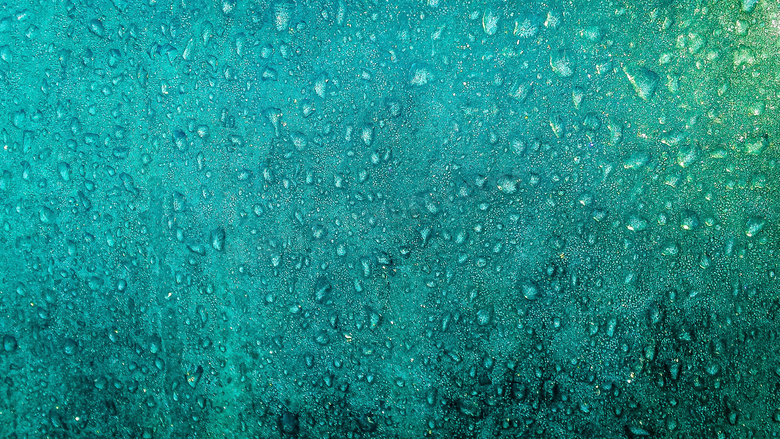 蓝色雨滴玻璃背景图片
