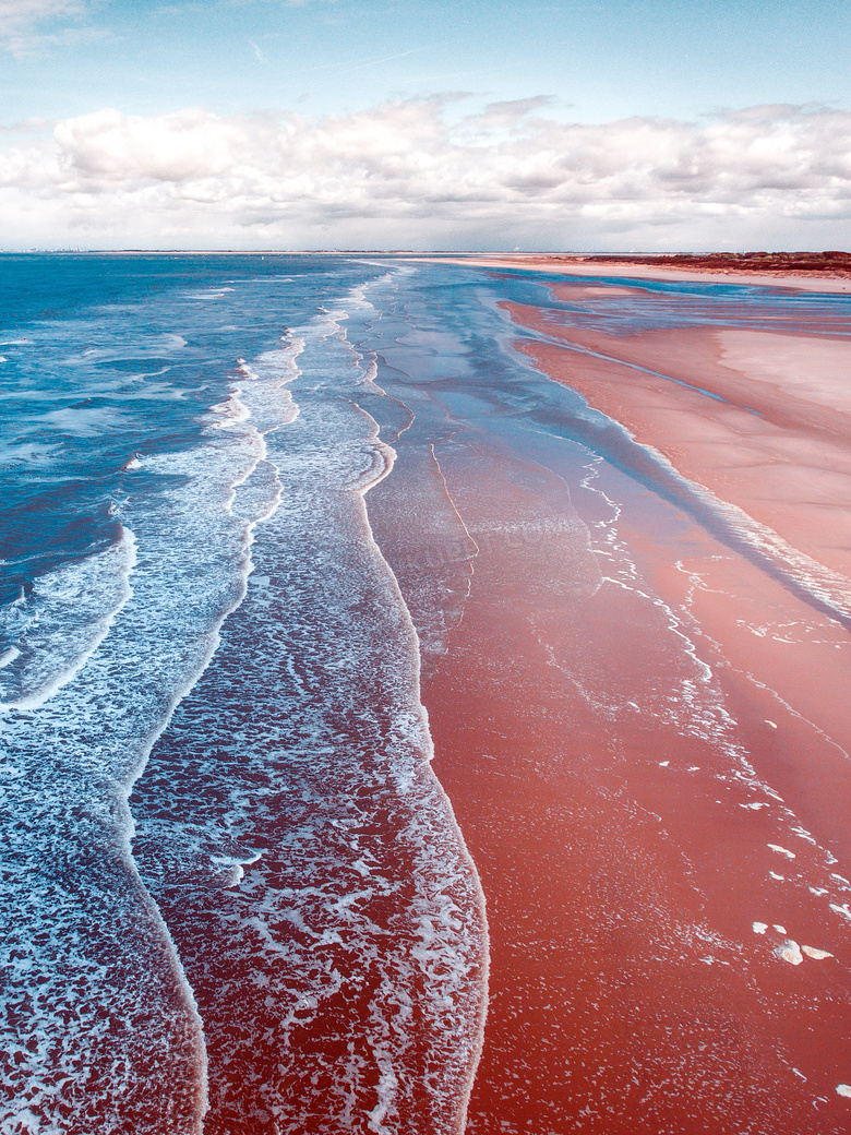 海浪打击沙滩景观摄影图片