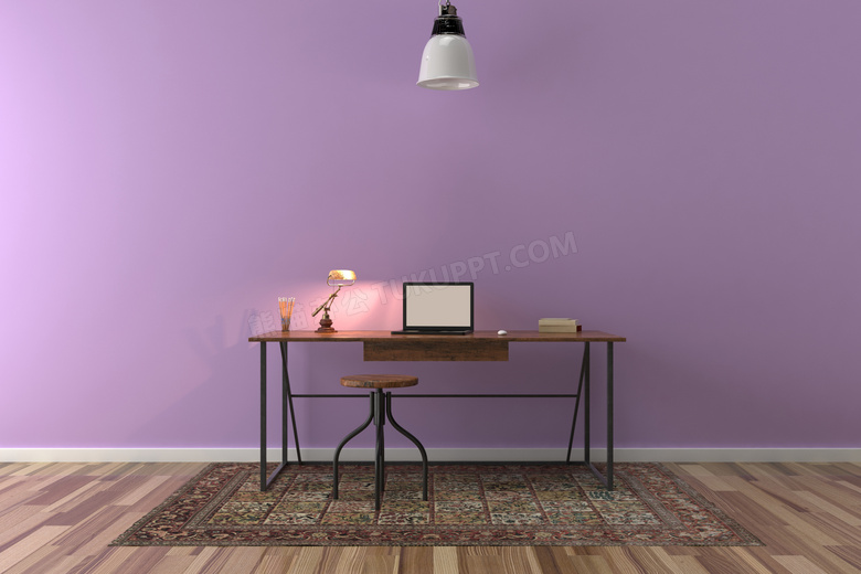 书桌电脑与紫色的墙面摄影高清图片