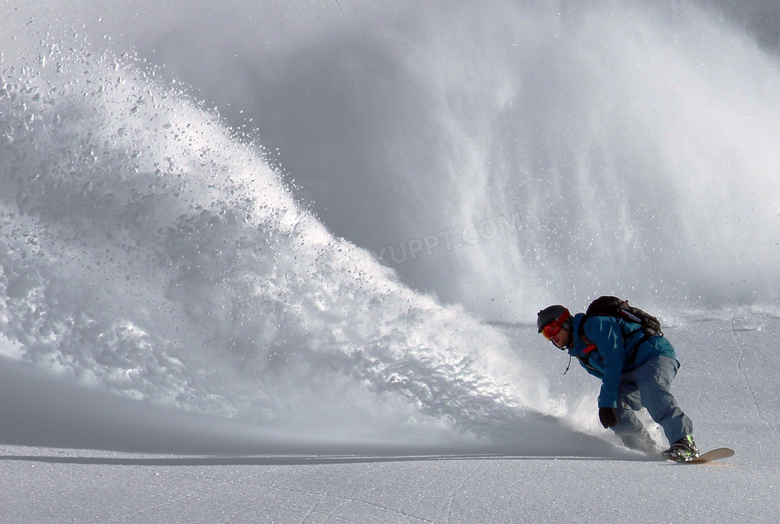 飞溅起积雪的滑雪人物摄影高清图片
