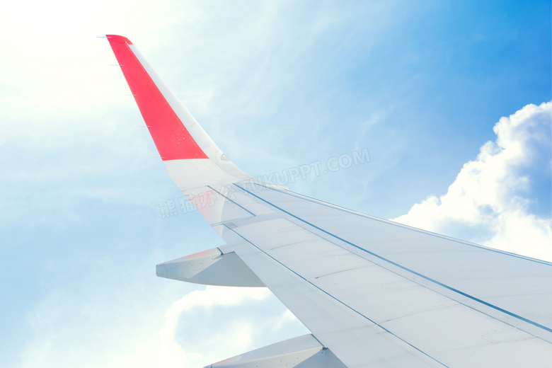 蓝天白云与飞机的机翼摄影高清图片
