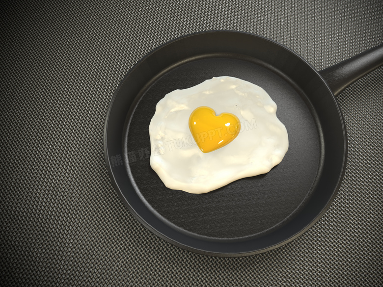 在平底锅里的心形煎蛋摄影高清图片