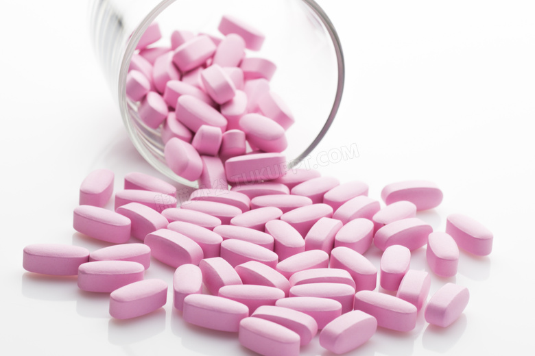 倒出来的粉红色的药品摄影高清图片