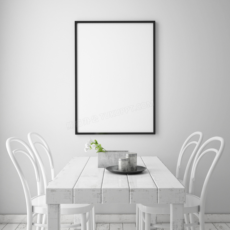 桌椅与挂在墙上的画框摄影高清图片