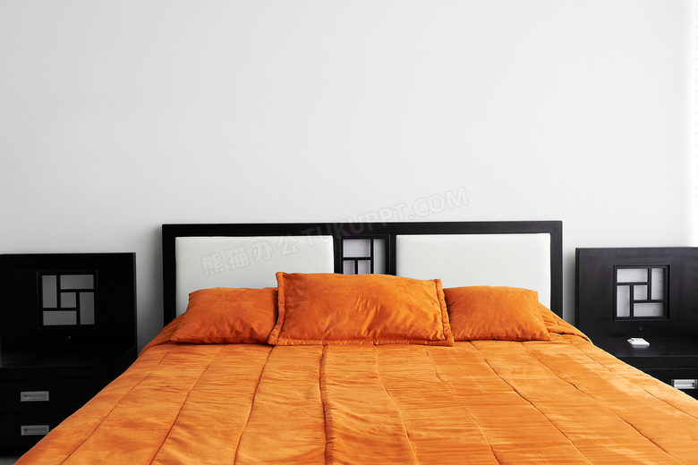 卧室橙色床上用品布置摄影高清图片