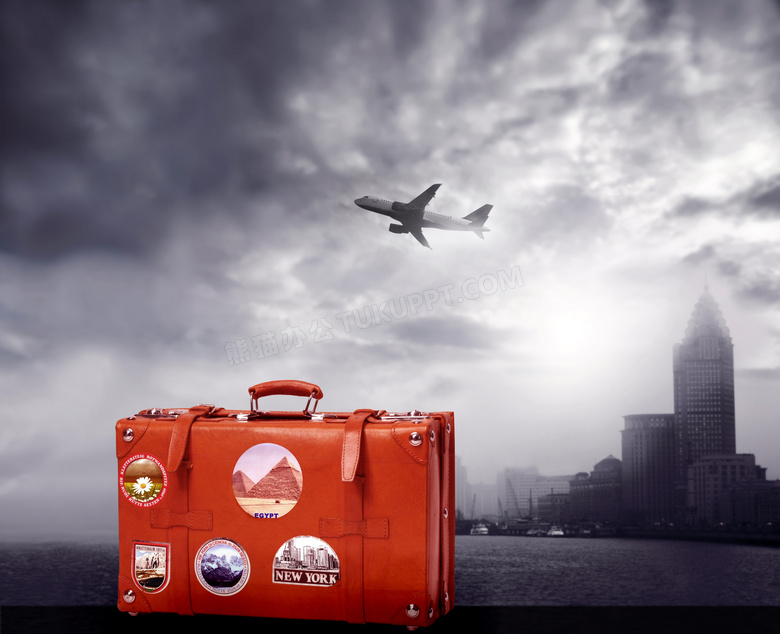 红色旅行箱与飞机大楼摄影高清图片