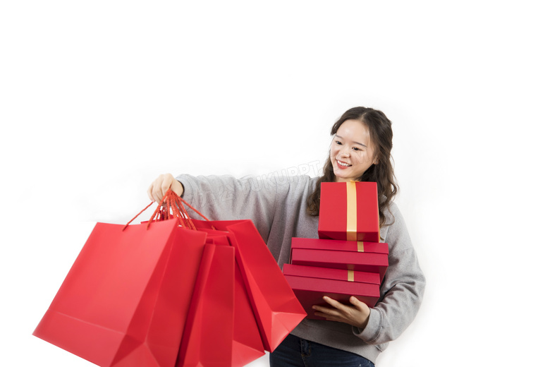 新年开心手提购物袋手捧礼物盒的女性