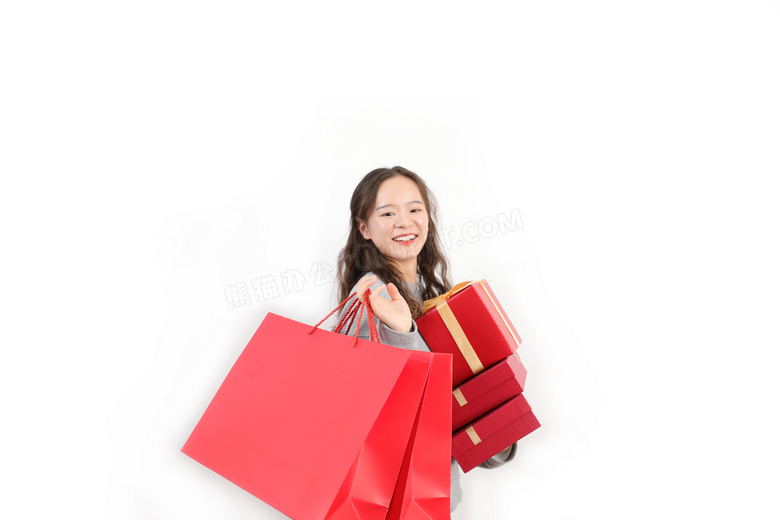新年手拿礼物盒购物袋的女性