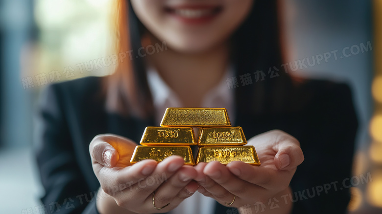 金融贸易手拿黄金金条图片