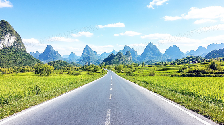 草地公路山峰蓝天白云图片