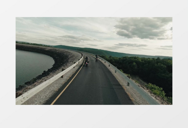 高清实拍摩托车在河边的道路上疾驰实拍视频素材