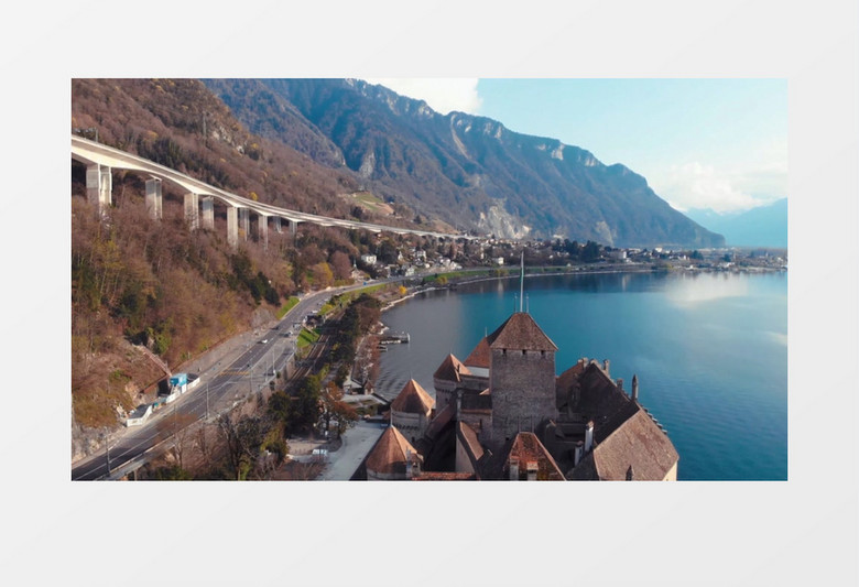 山脚下沿河修建的道路实拍视频素材