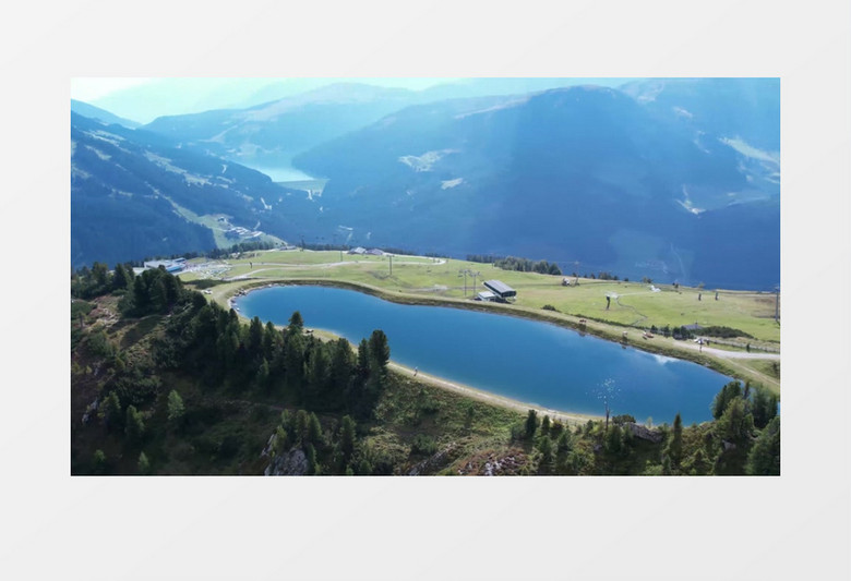 航拍山顶上的湖水和山丘风光实拍视频素材