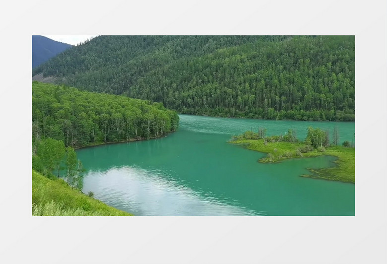 茂盛的山林和山脚下静谧的湖泊实拍视频素材