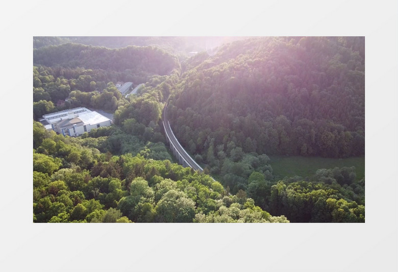 航拍屹立在山林中的道路实拍视频素材