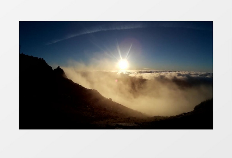 山巅之上云雾缭绕遮不住耀眼的日光壮观景象实拍视频素材
