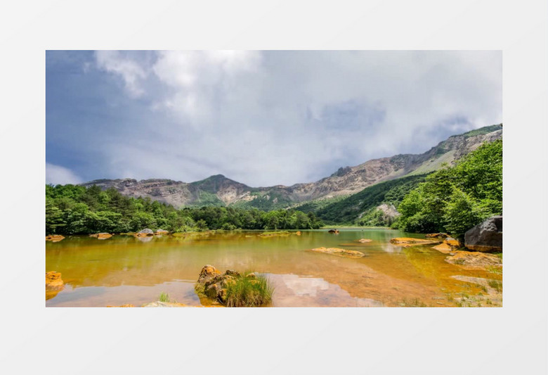 美丽的大山脚下清澈的湖水及漂泊的云彩视频素材