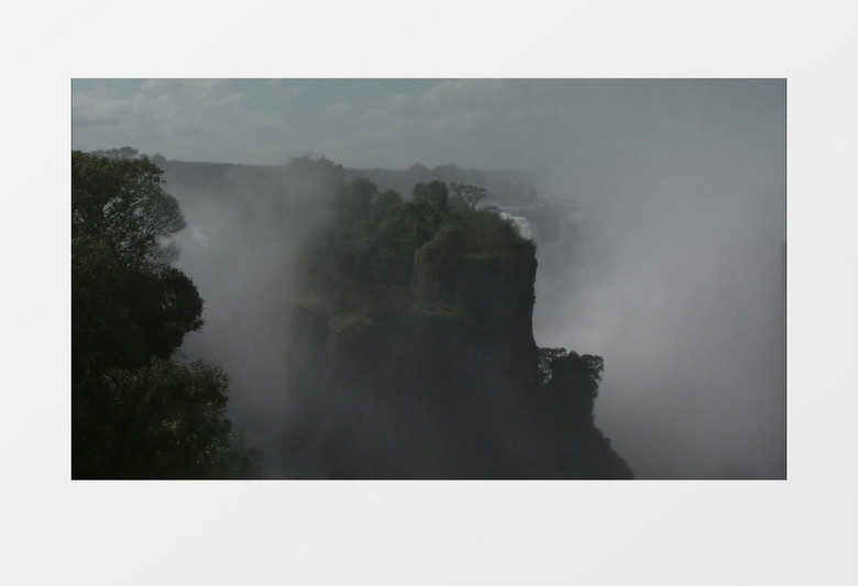云雾朦胧山间森林和瀑布高清实拍视频素材